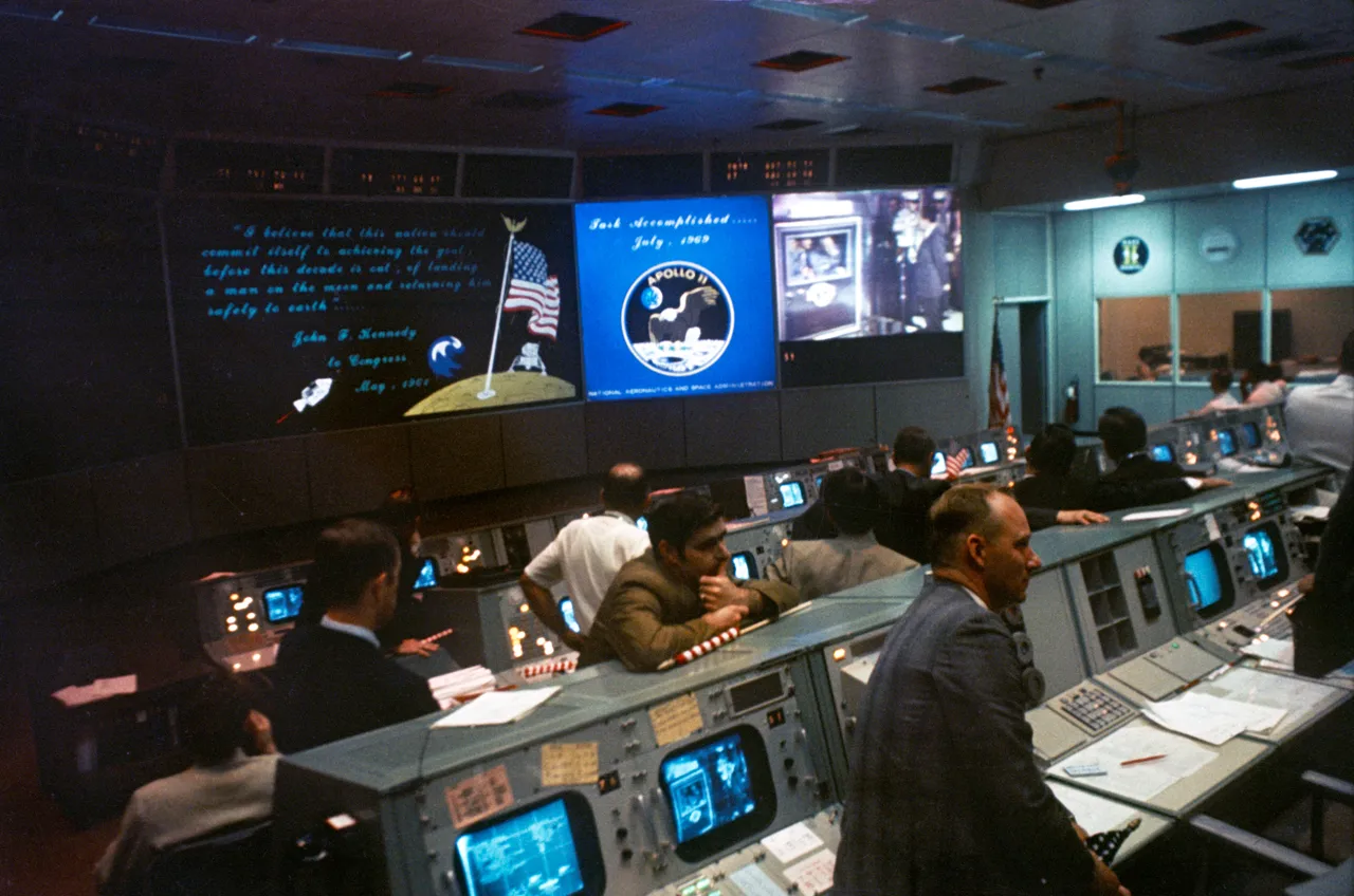Apollo 11 Mission Operations Control Room crowded with consoles and staff